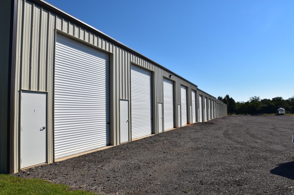 Row of drive-up storage units with wide driveways